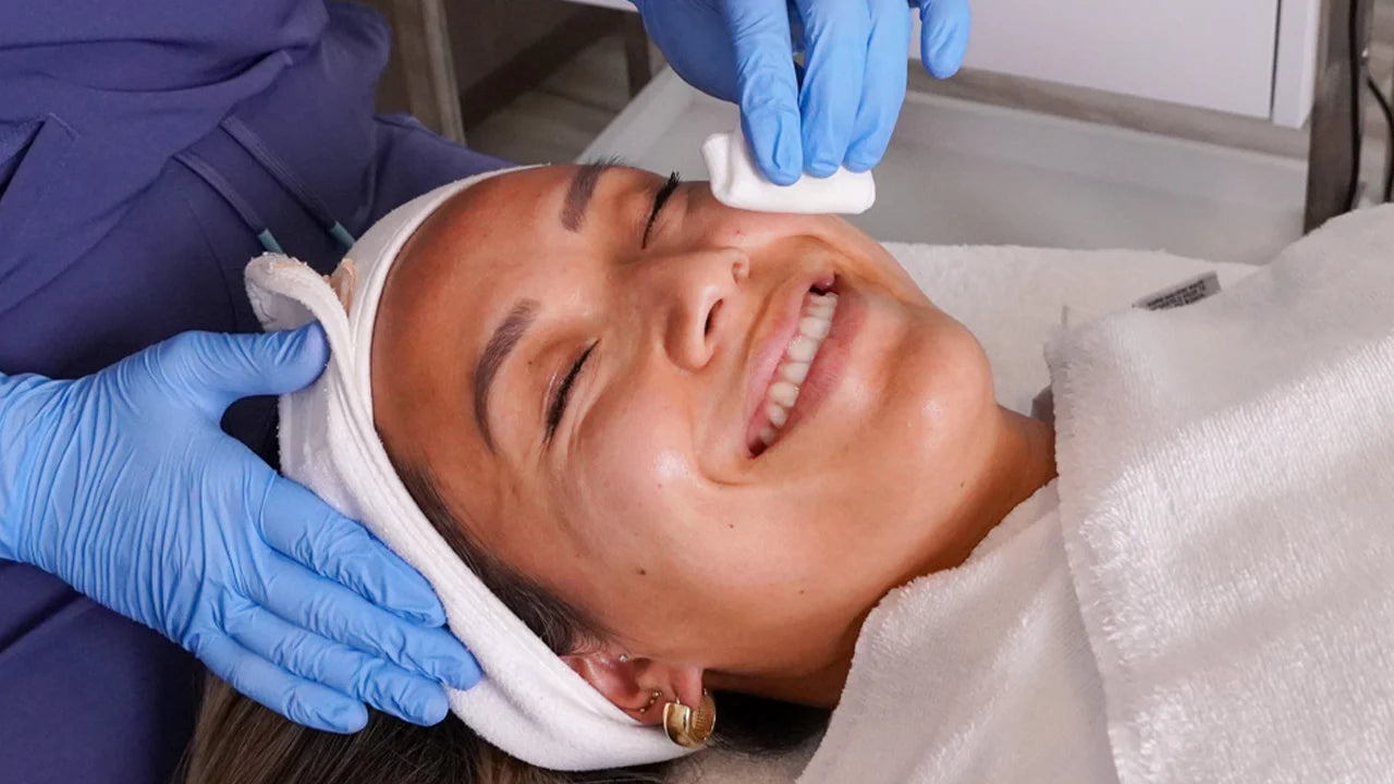 Person applying skincare cream